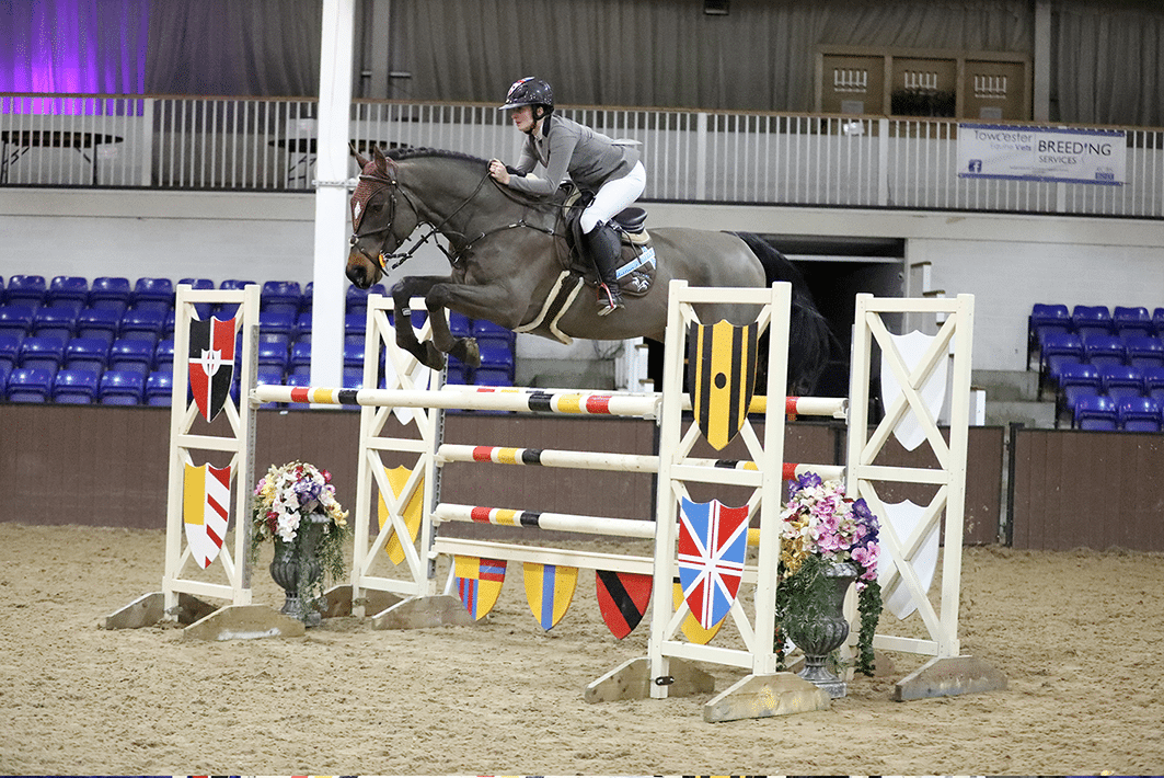 Pieter VI winning the Winter Grand Prix at Bury Farm ridden by Louise Saywell and owned by James Hughes.